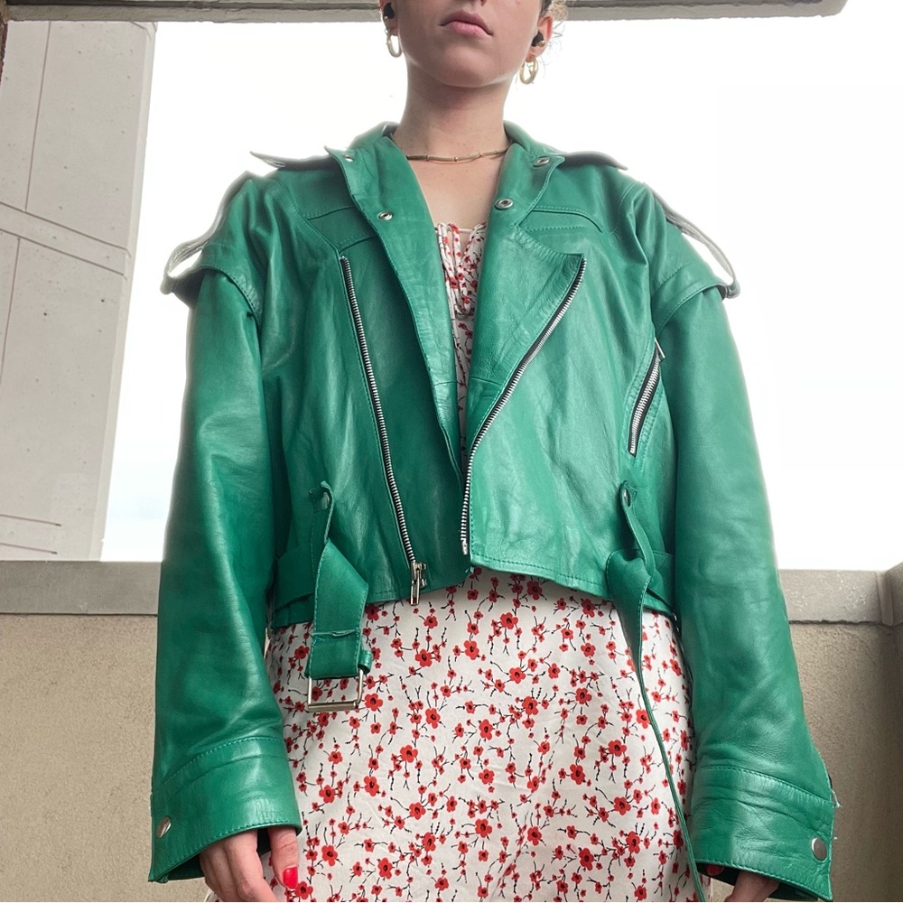 Green leather motorcycle jacket.